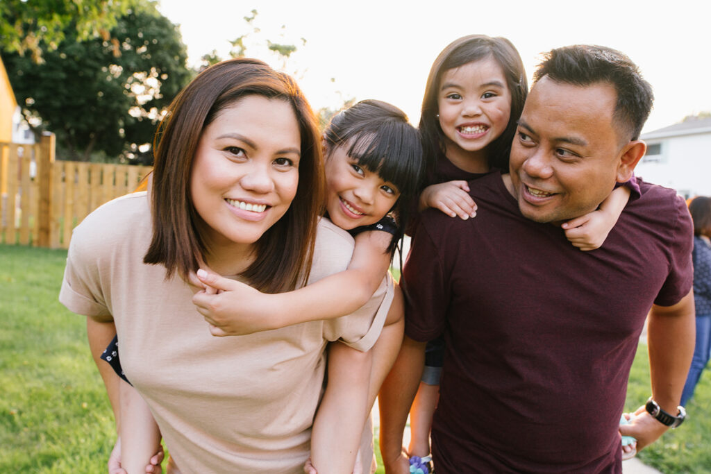 Smiling family with two kids