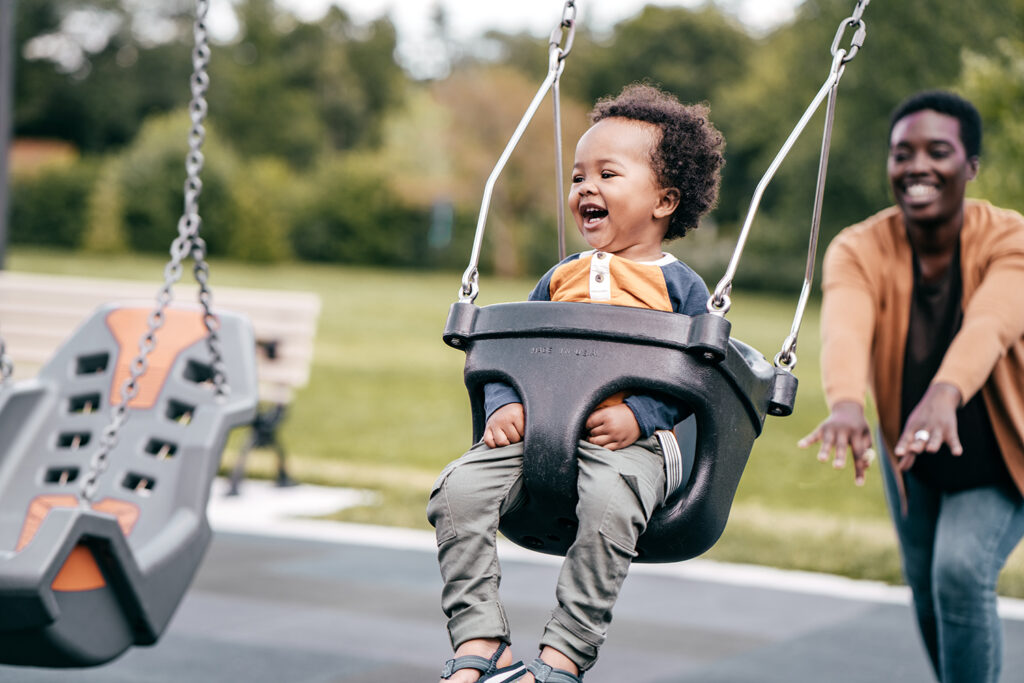 Mother and toddler spending time in the playground